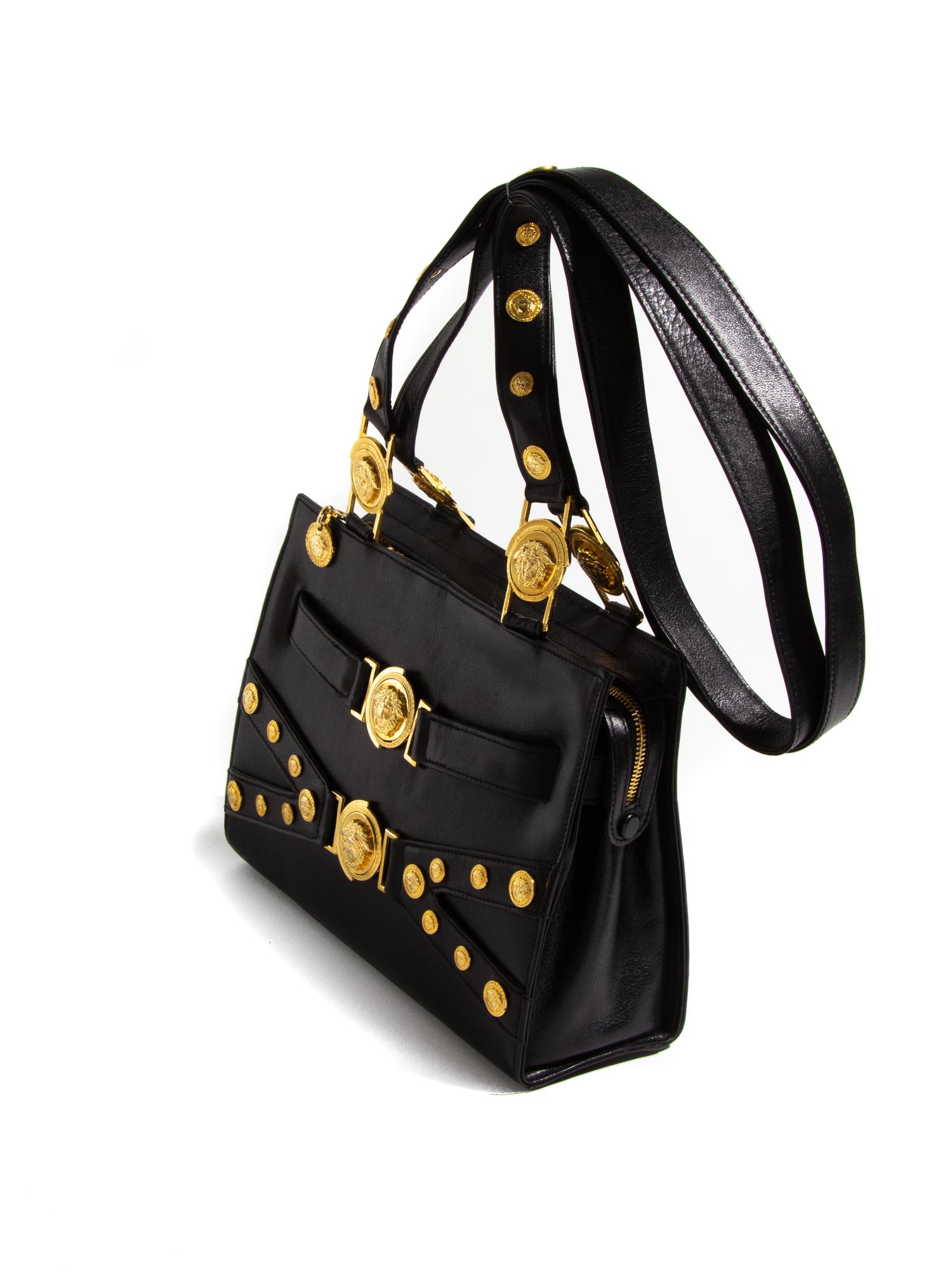 A Gianni Versace Black Leather Shoulder Bag, 11" x 8.25" x 3.5"; Strap drop: 21".
