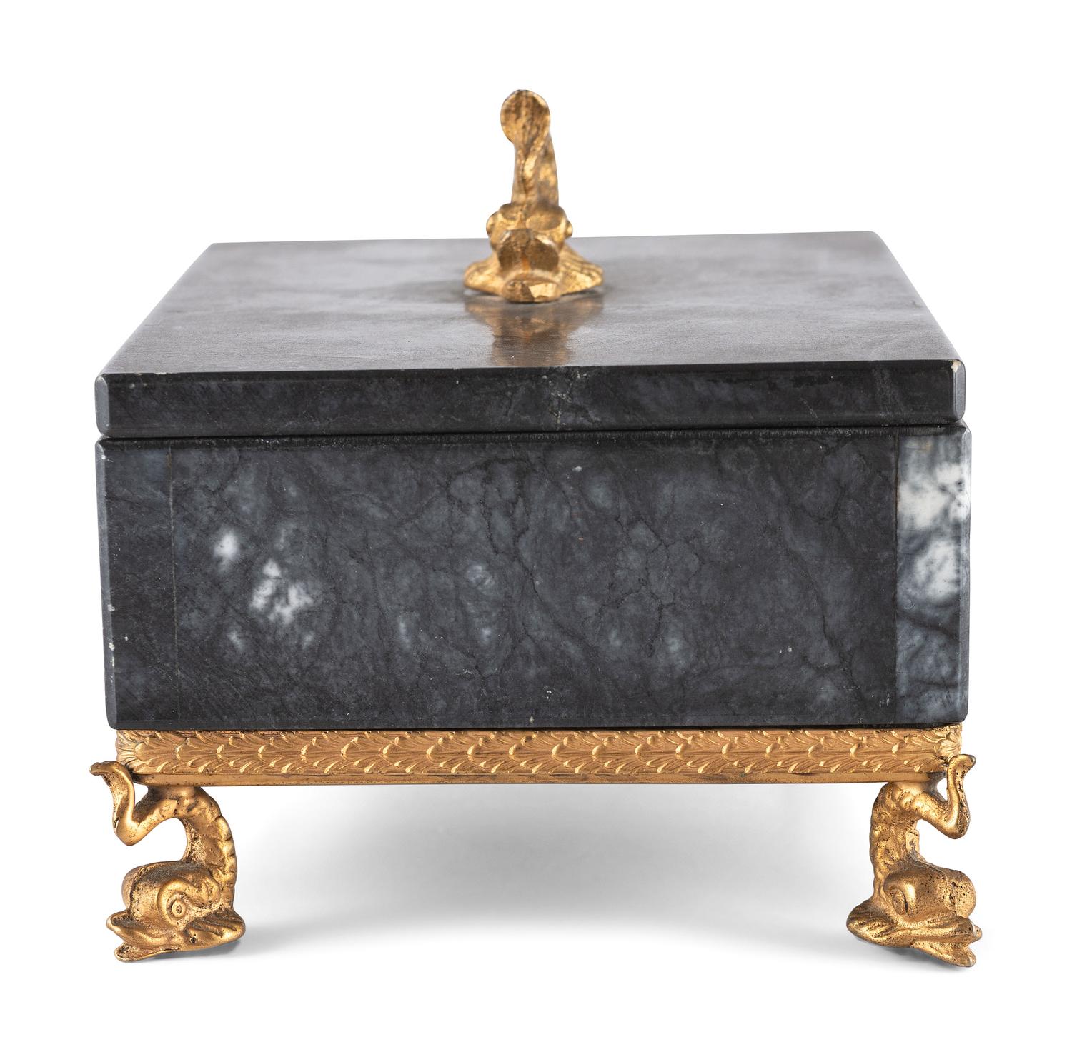 A Gilt and Black Onyx Box with Dolphin Finial