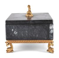 A Gilt and Black Onyx Box with Dolphin Finial