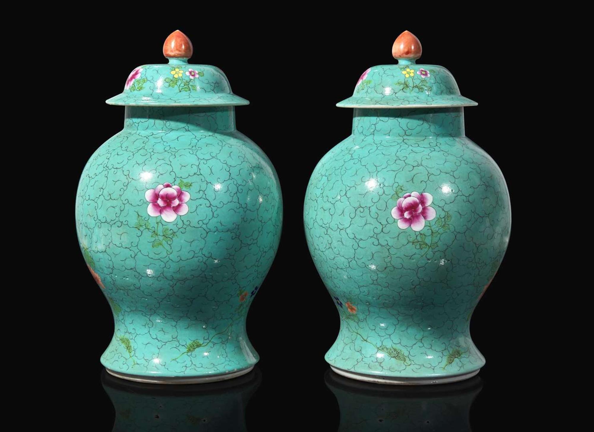 A pair of Chinese turquoise ground jars and covers 松石綠地蓋罐一對