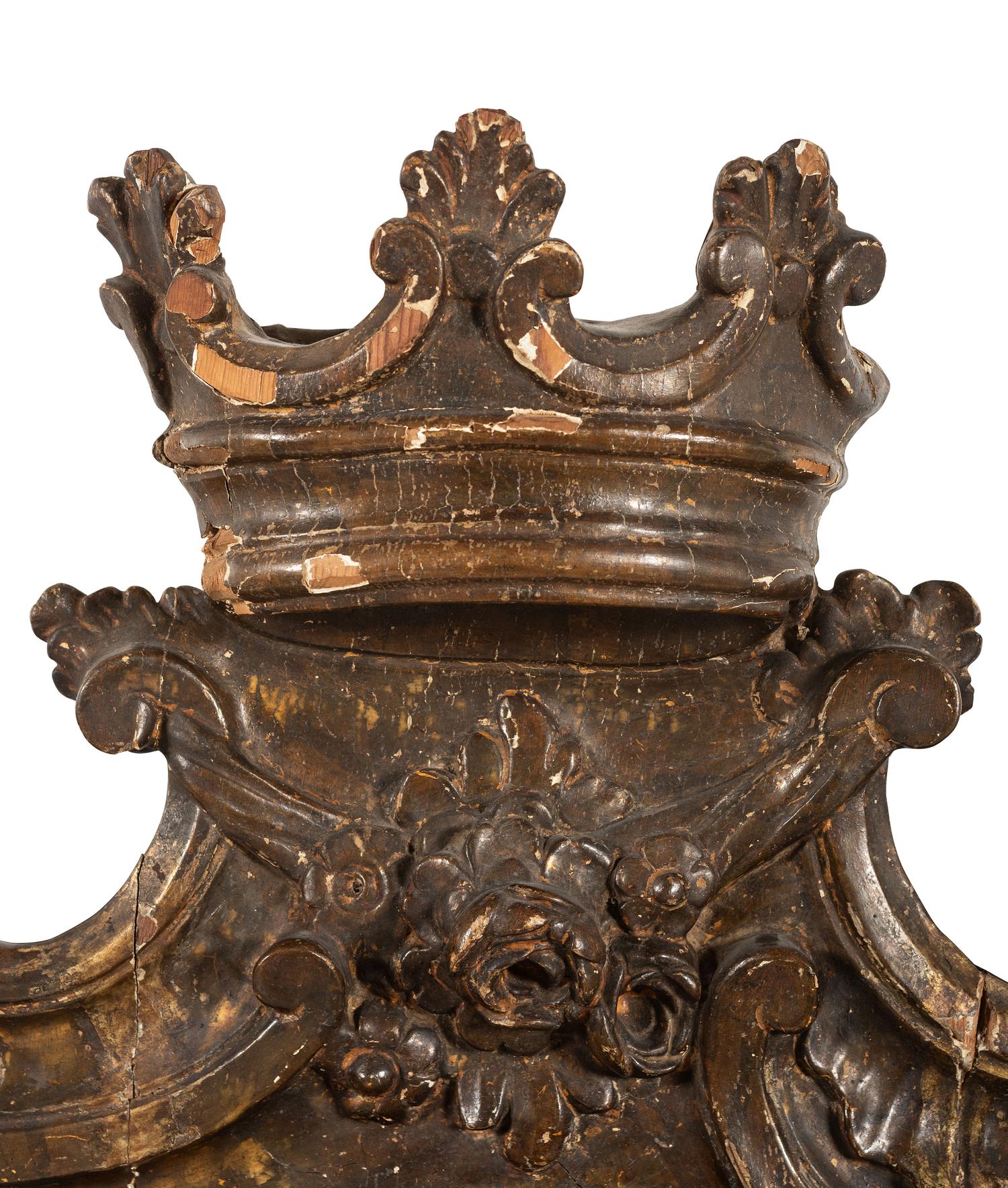 A Continental Carved, Painted and Parcel Gilt Mirror