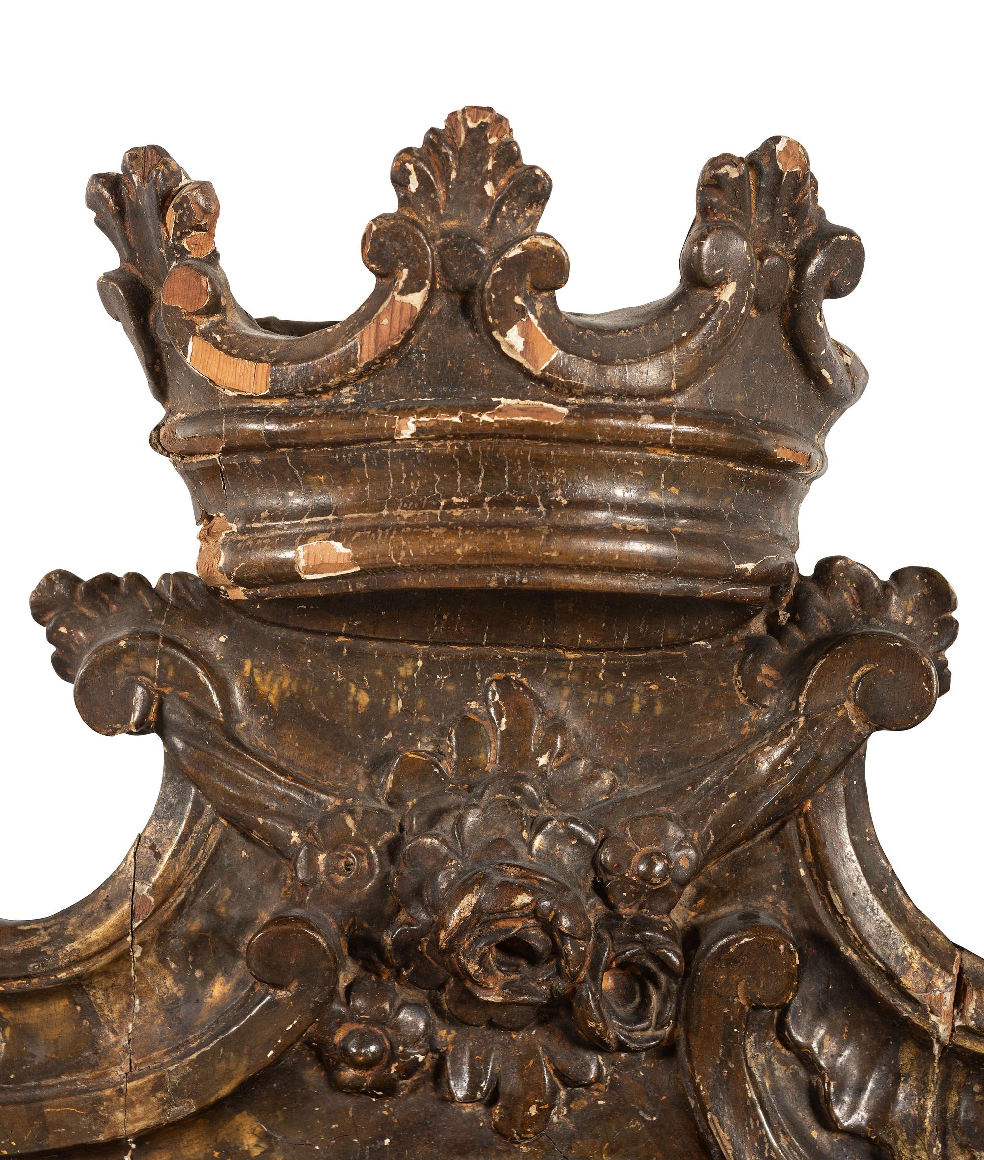 A Continental Carved, Painted and Parcel Gilt Mirror