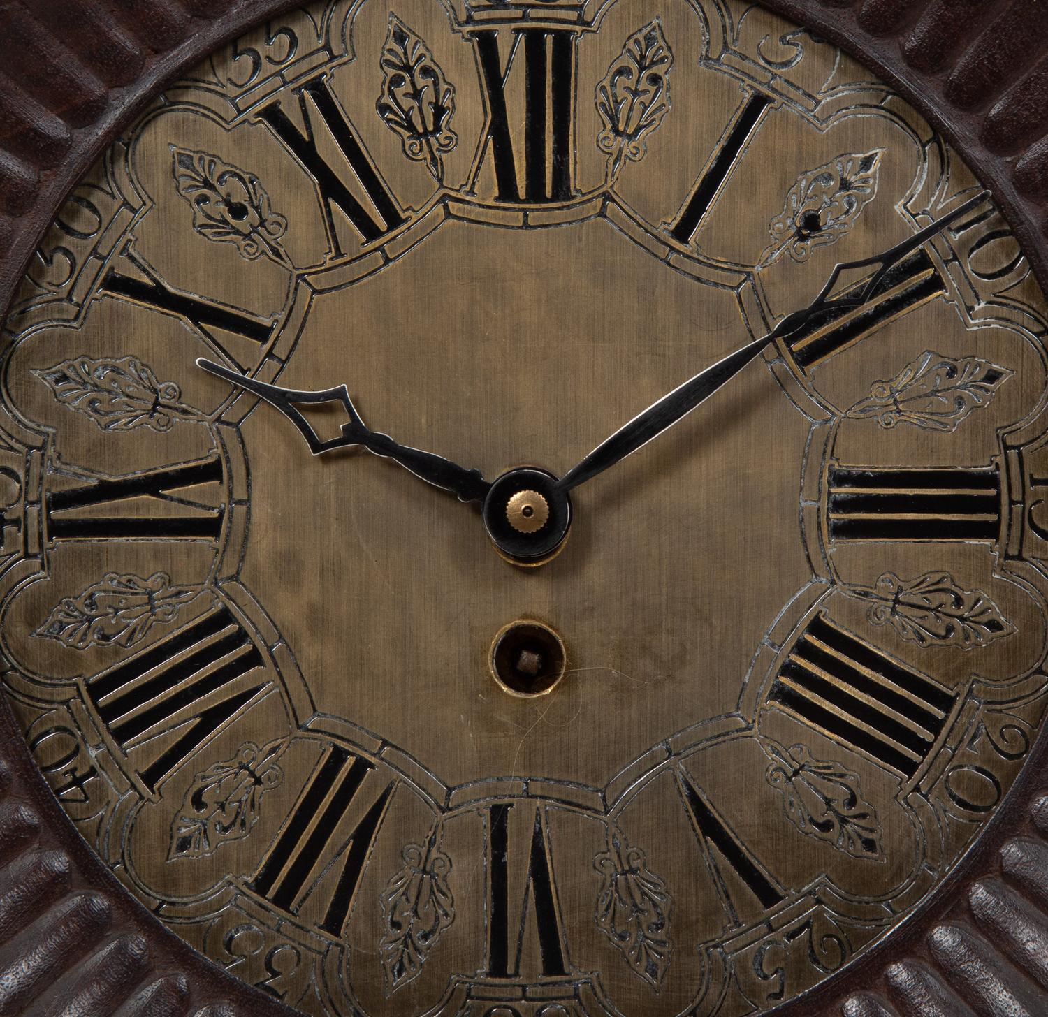 A Continental Carved Oak Figural Clock