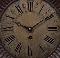 A Continental Carved Oak Figural Clock