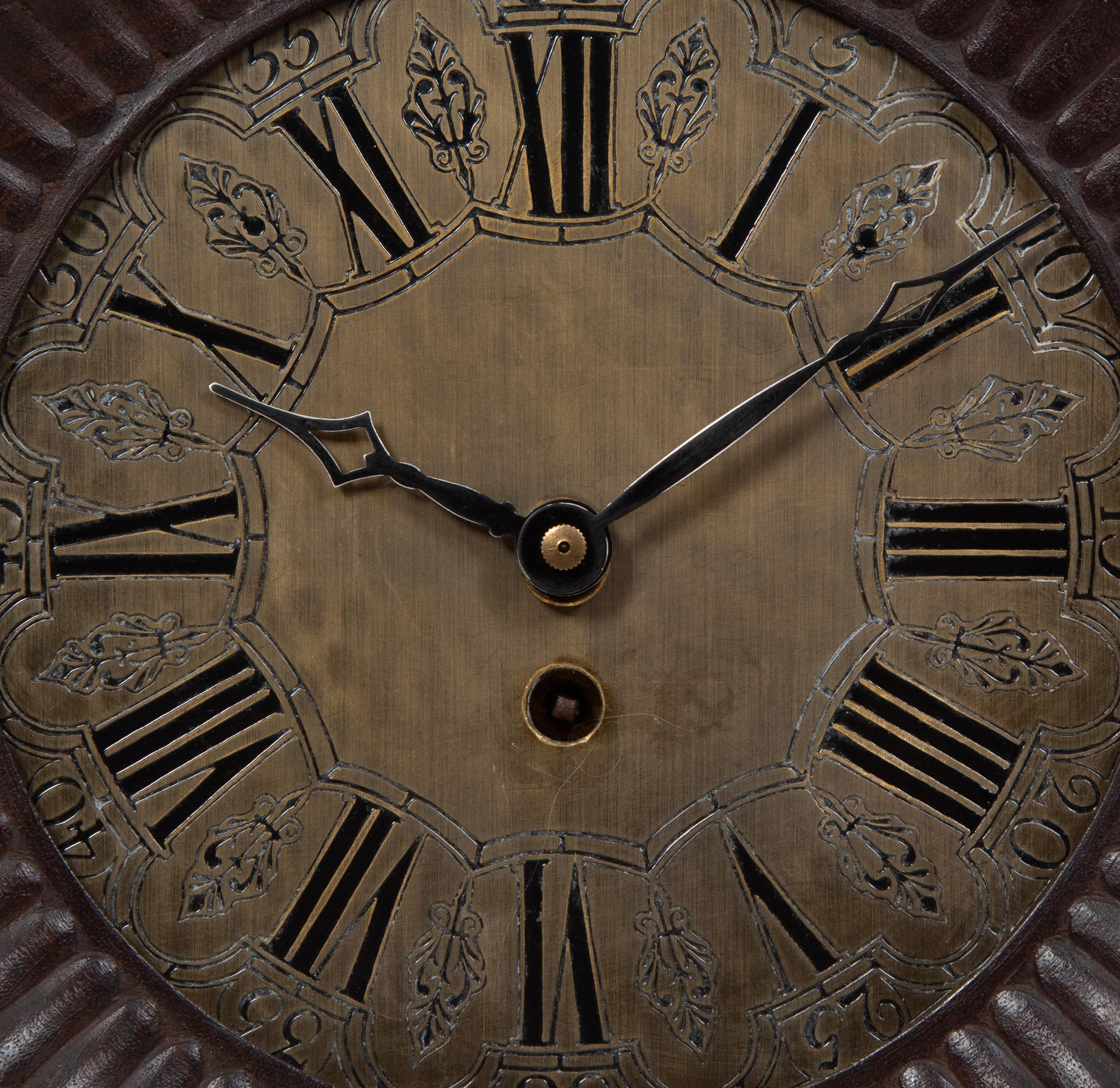 A Continental Carved Oak Figural Clock