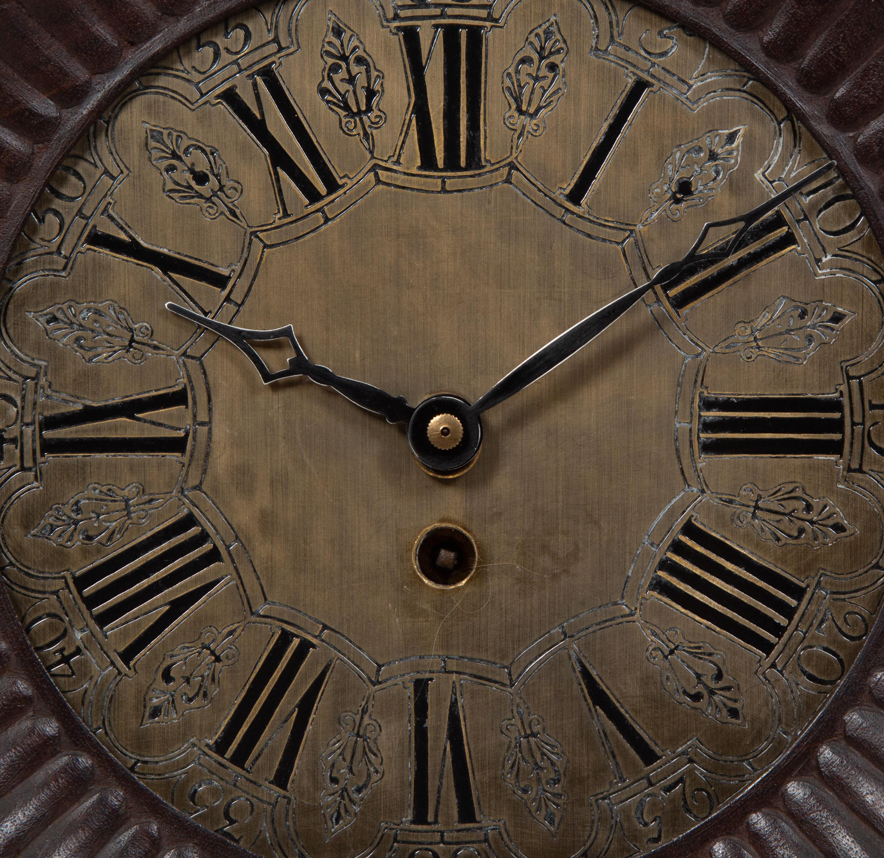 A Continental Carved Oak Figural Clock