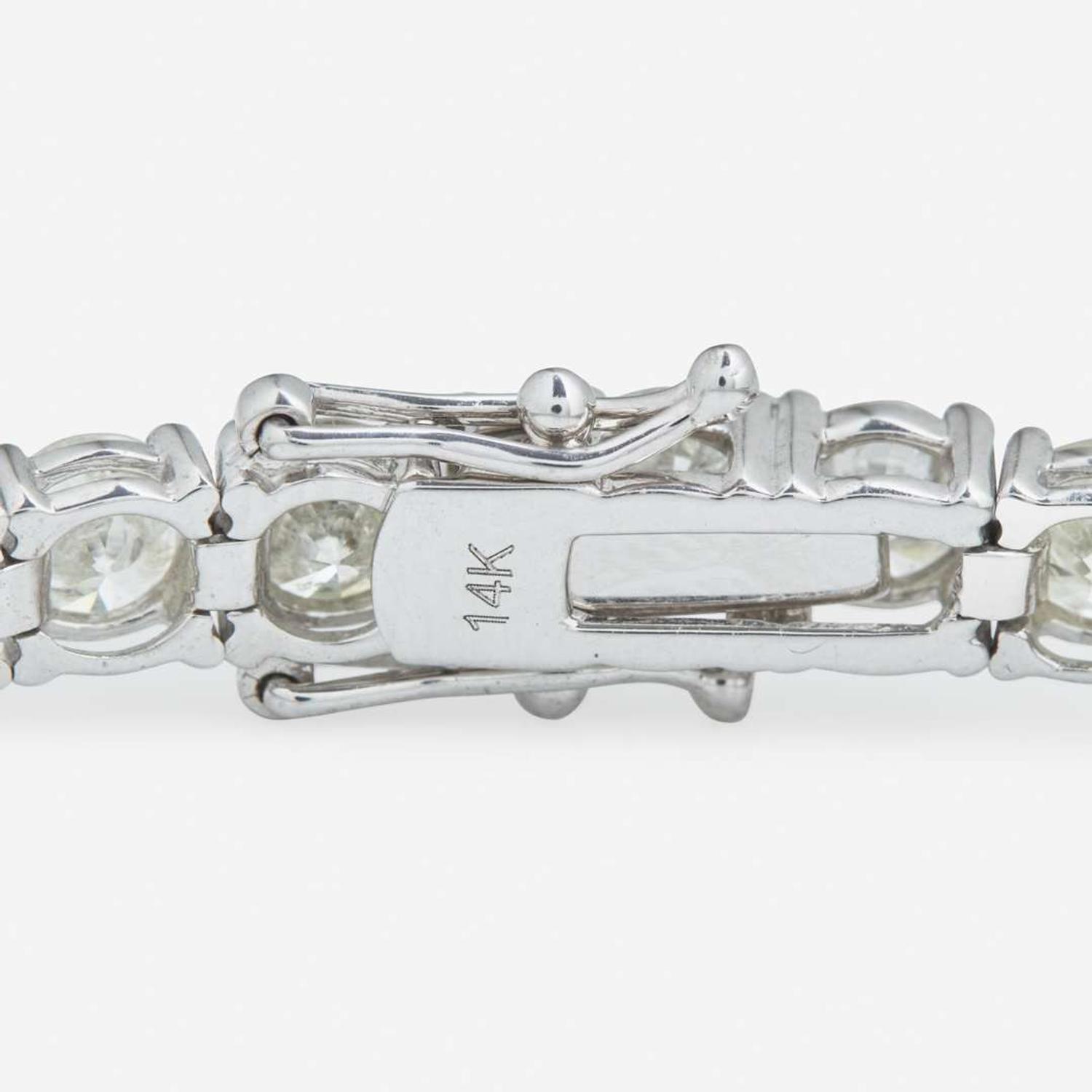 A 14K White Gold and Diamond Line Bracelet