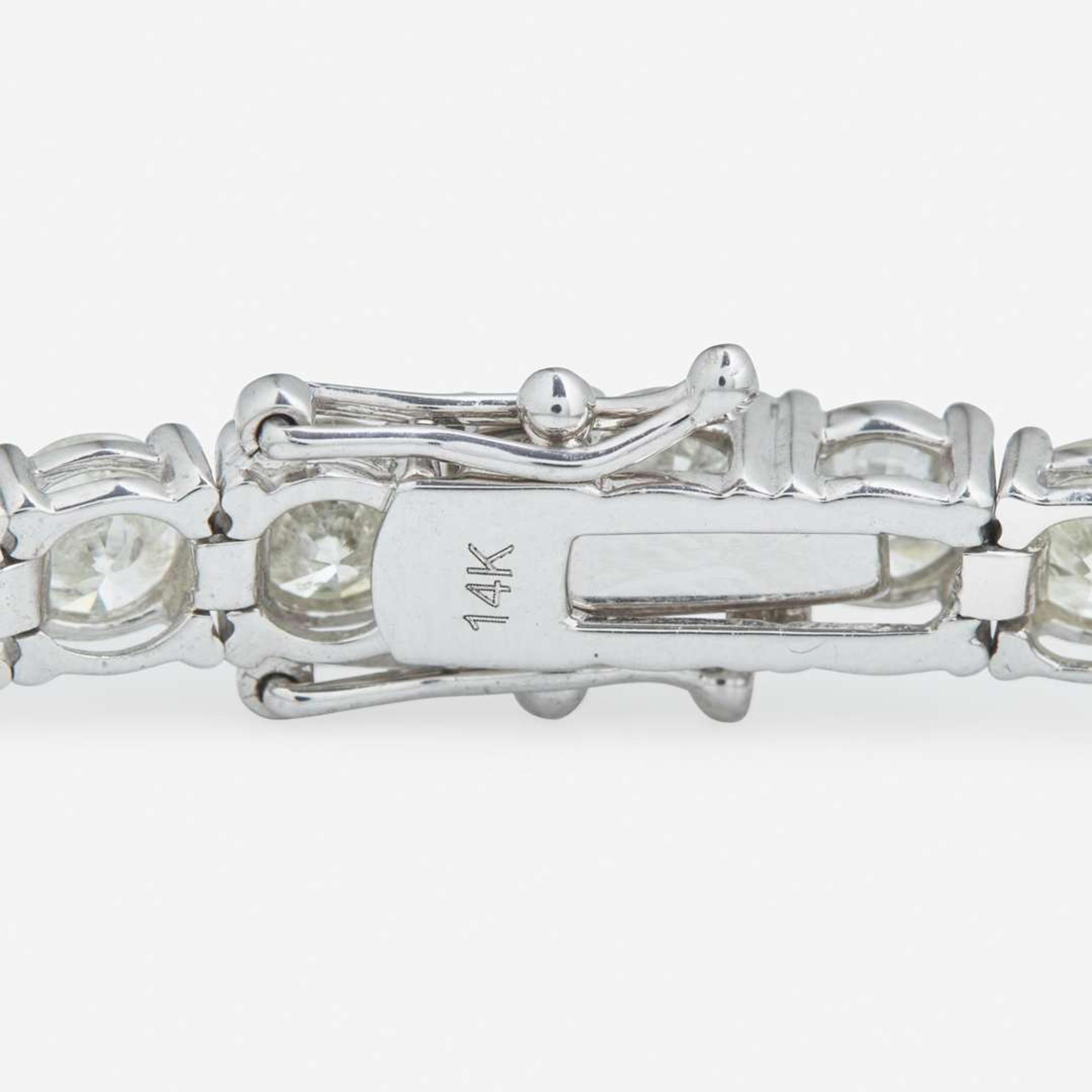 A 14K White Gold and Diamond Line Bracelet