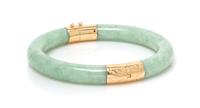 A Yellow Gold and Jadeite Bangle, 26.60 dwts.