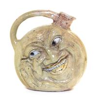 A Martin Brothers Salt Glazed Stoneware Face Jug Height 9 1/2 inches. — CIRCA 1900