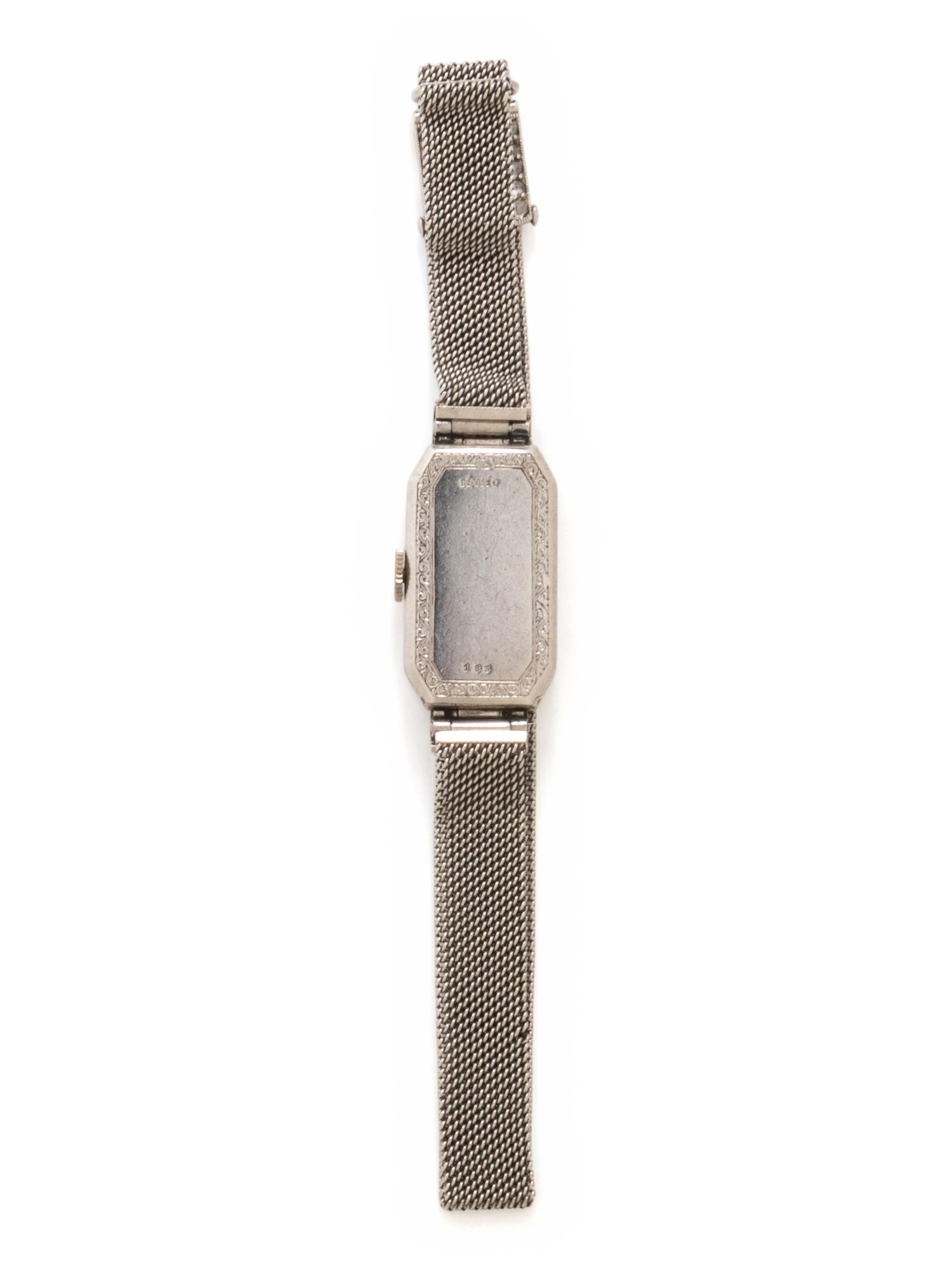 GÜBELIN, PLATINUM, DIAMOND, SYNTHETIC SAPPHIRE AND BLACK ONYX WATCH
