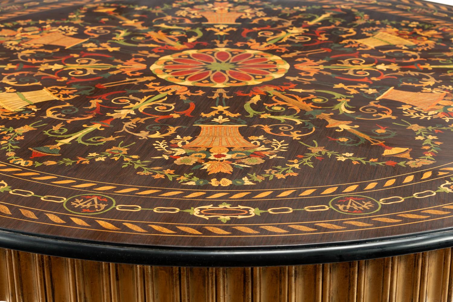 A Continental Parcel Ebonized Marquetry Center Table
