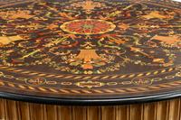 A Continental Parcel Ebonized Marquetry Center Table