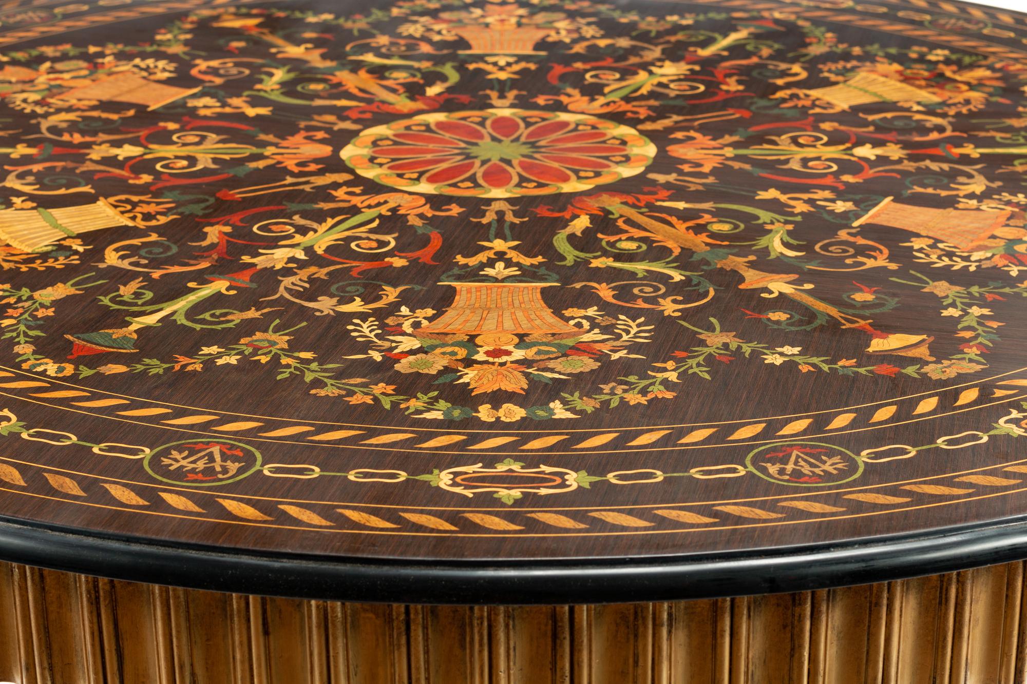 A Continental Parcel Ebonized Marquetry Center Table