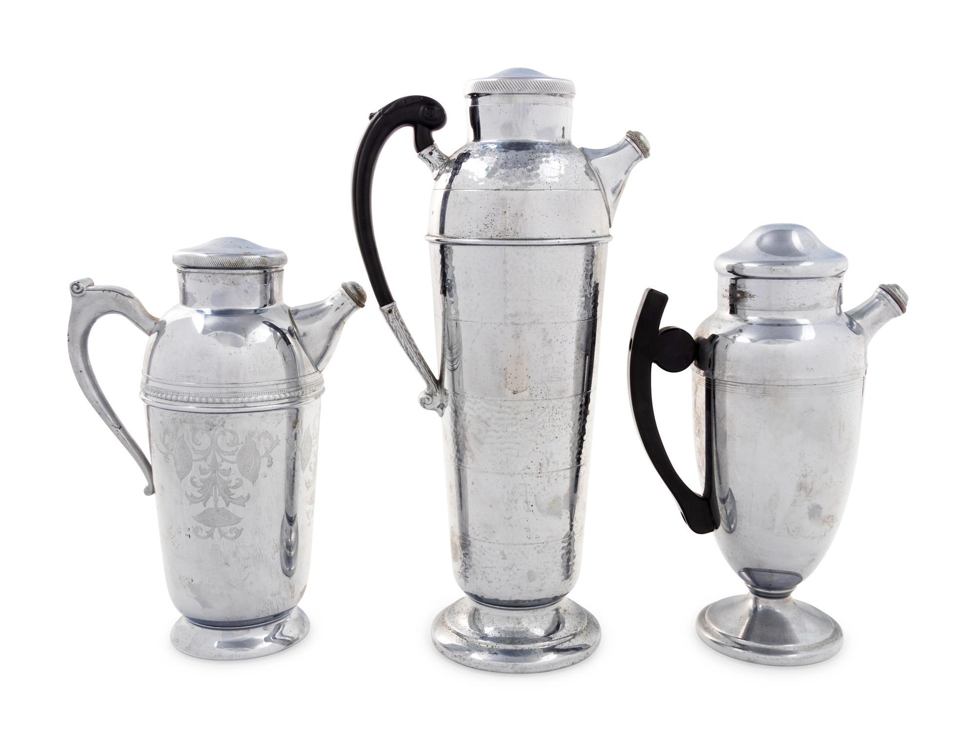 A Group of Three Cocktail Shakers
