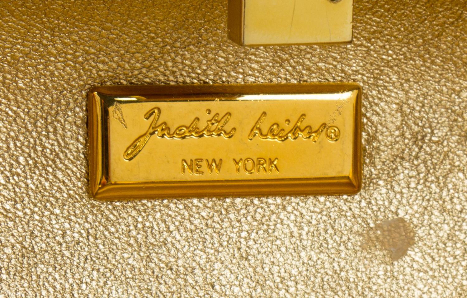 A Judith Leiber Mutlticolor Paisley Minaudiere, 3"H x 5.5"W x 1.5"D; Shoulder strap: 20".
