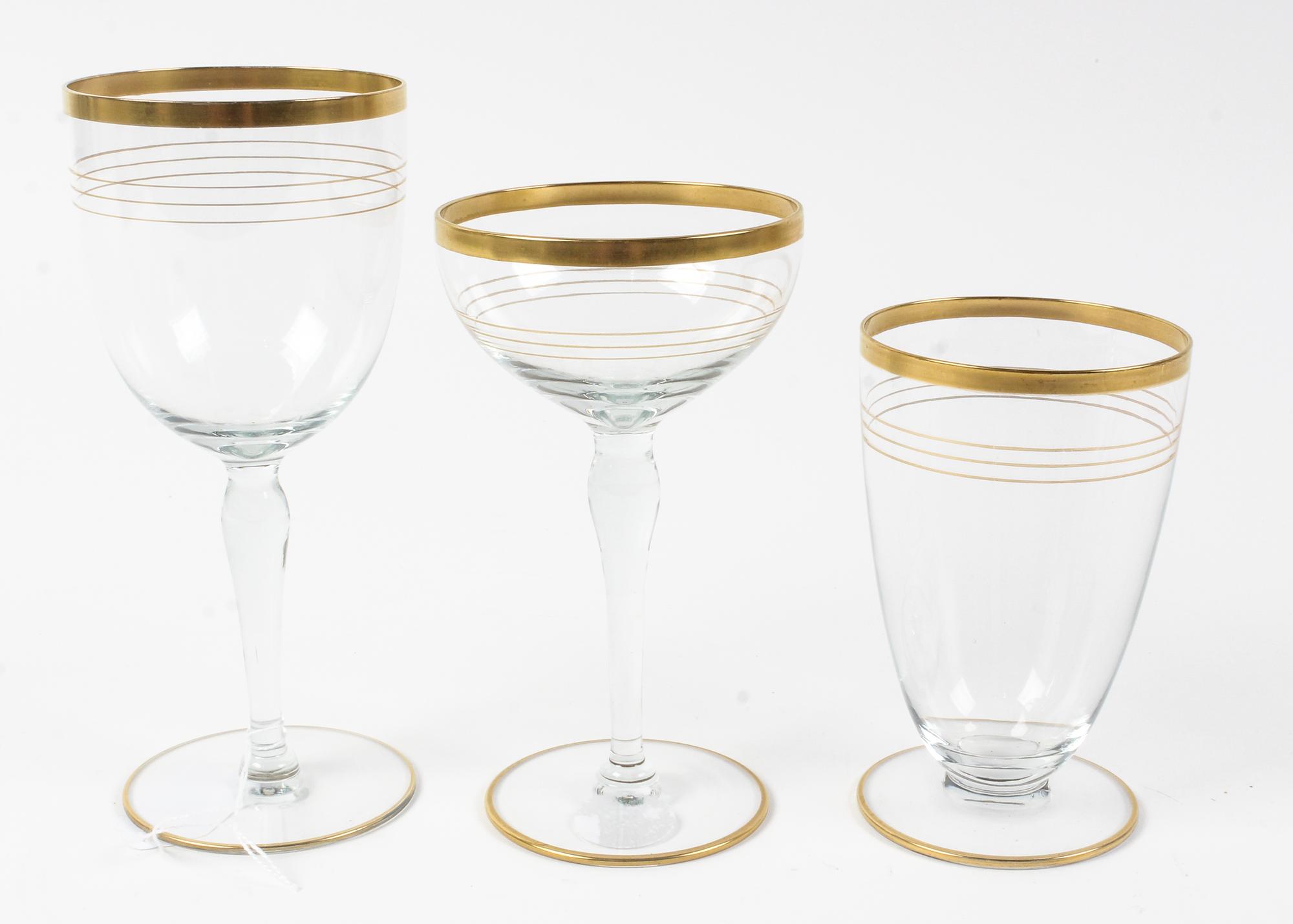 A Gilt Decorated Glass Stemware Service Height of wine 5 inches. — 20TH CENTURY
