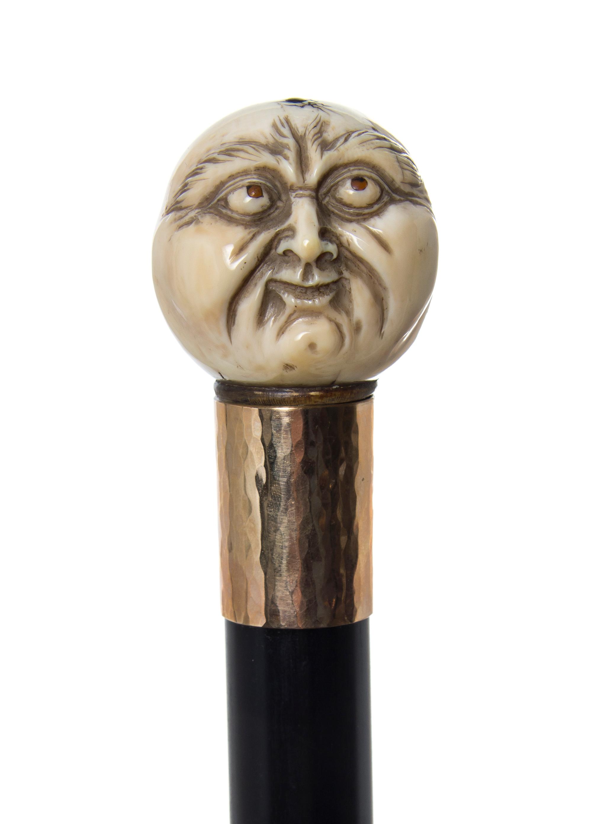 A Japanese Ivory Handled Walking Stick, Diameter of handle 1 1/2 x length overall 36 3/8 inches.