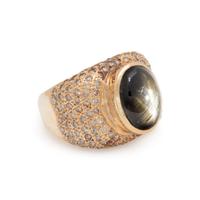 BLACK STAR SAPPHIRE, DIAMOND, AND YELLOW GOLD RING