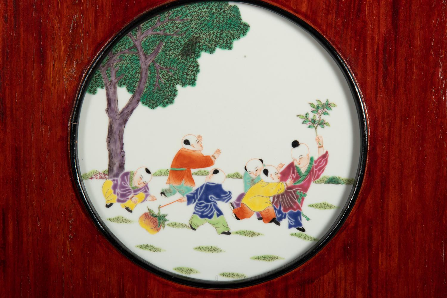 A Set of Four Chinese Famille Rose Porcelain Inset Hardwood Wall Panels