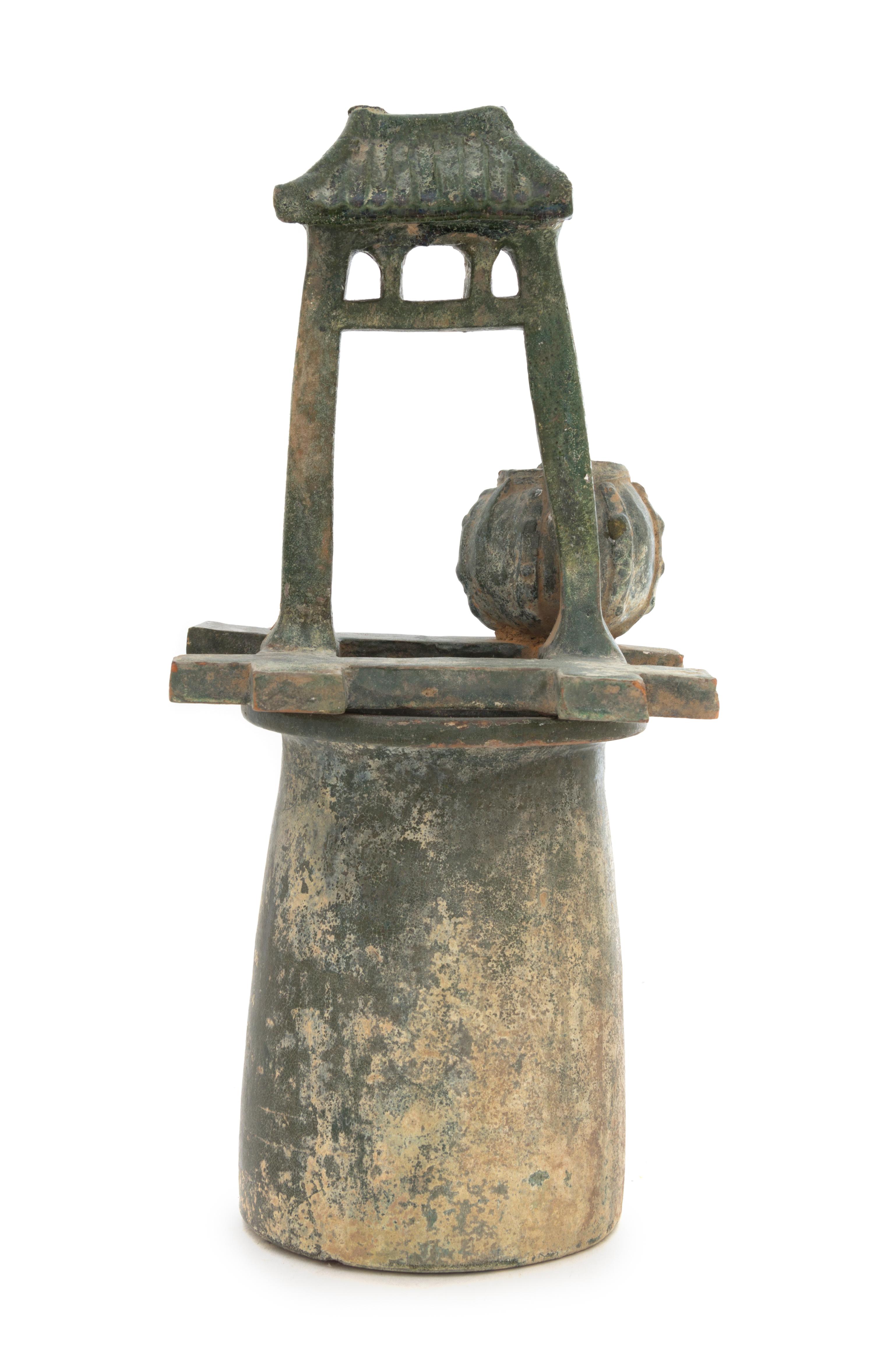 A Chinese Green Glazed Pottery Model of a Well Height 14 1/2 inches. — HAN DYNASTY (206 B.C. - A.D. 220)