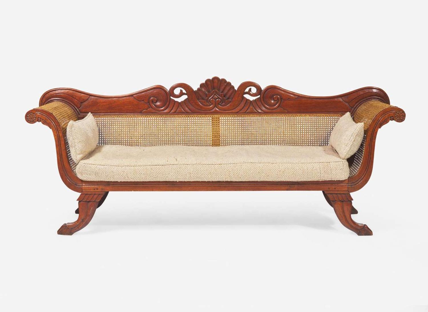 An Anglo-Colonial carved hardwood and caned sofa, first half 19th century