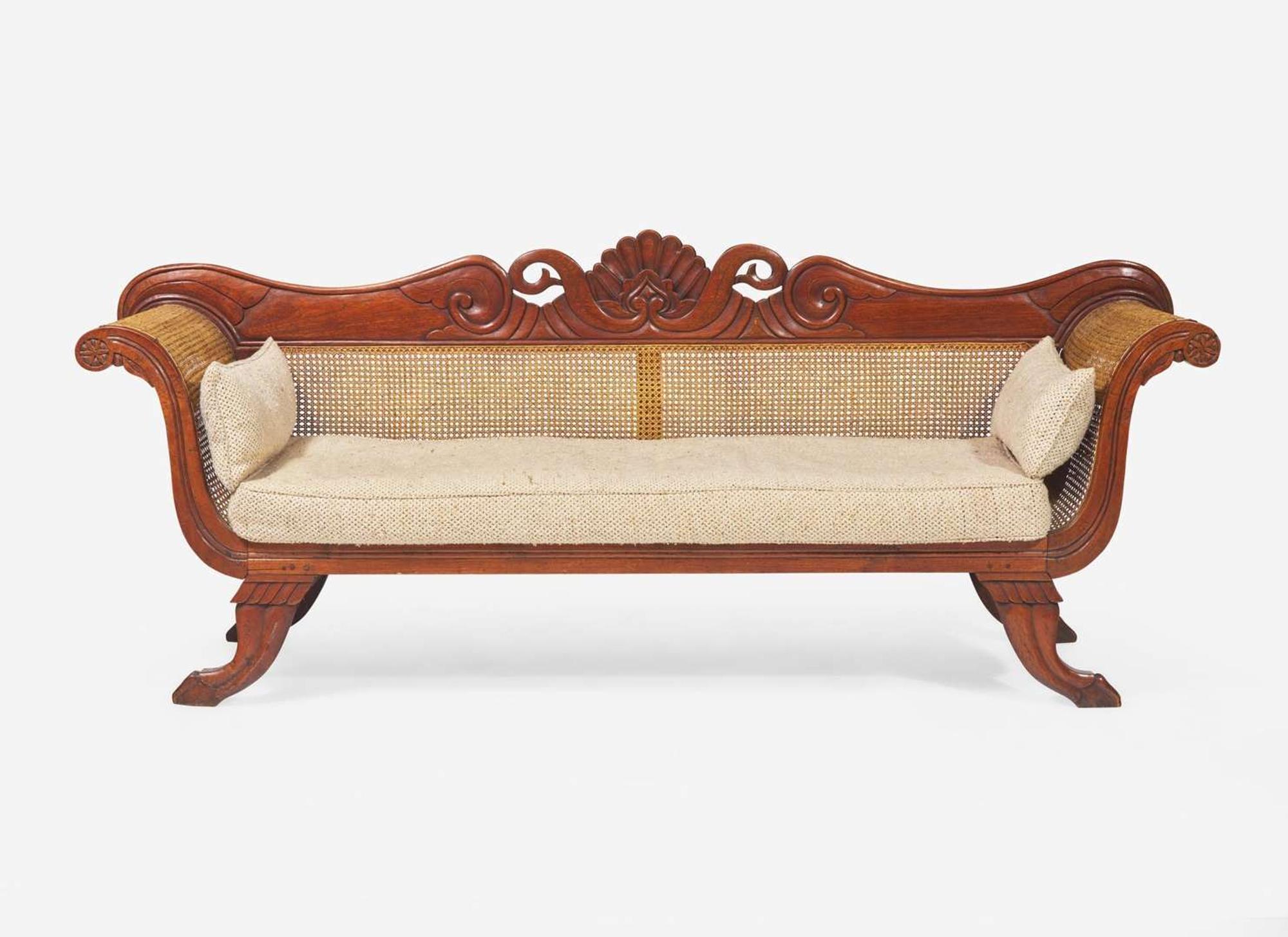 An Anglo-Colonial carved hardwood and caned sofa, first half 19th century