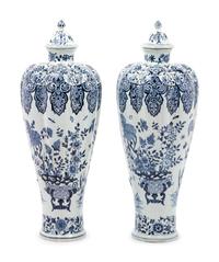 A Pair of Delft Covered Vases