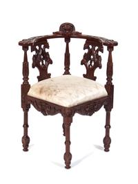 An English Mahogany Corner Chair Height 34 1/2 inches.