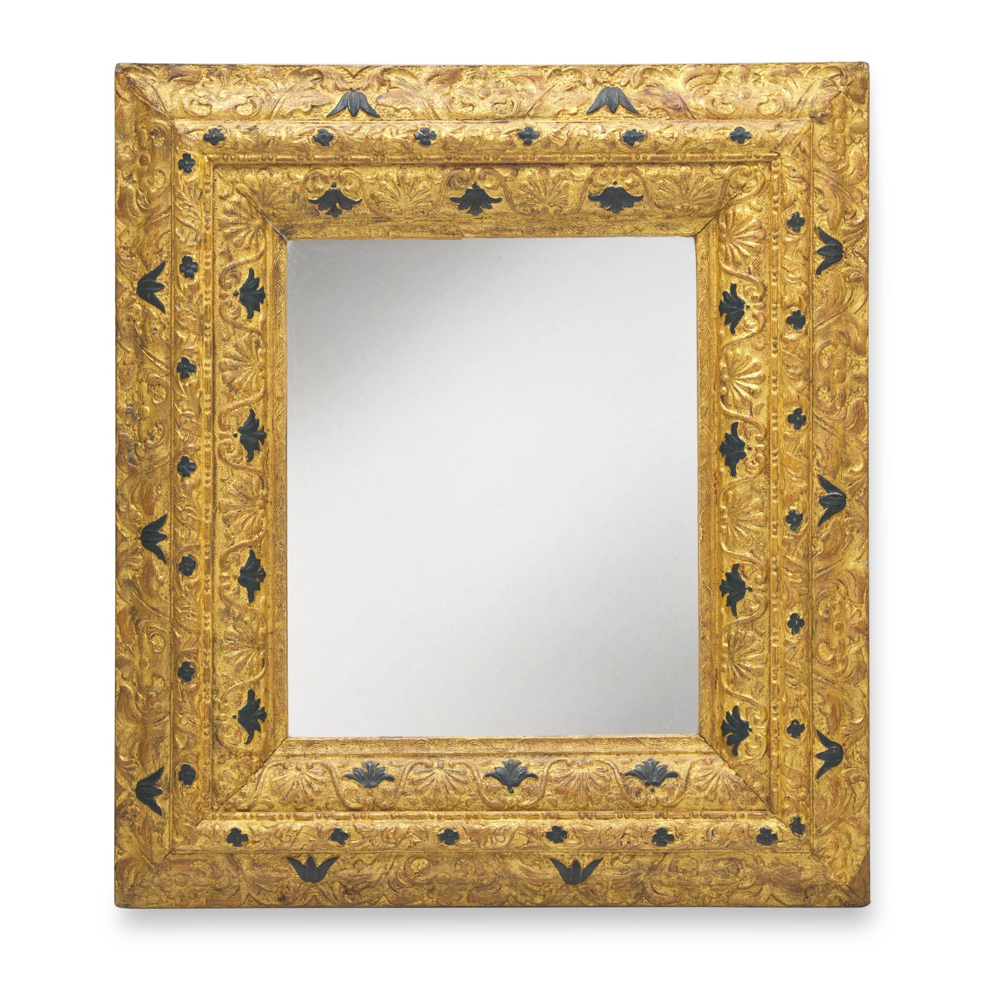 A Continental Giltwood and Parcel-Ebonized Frame, Mounted as a Mirror