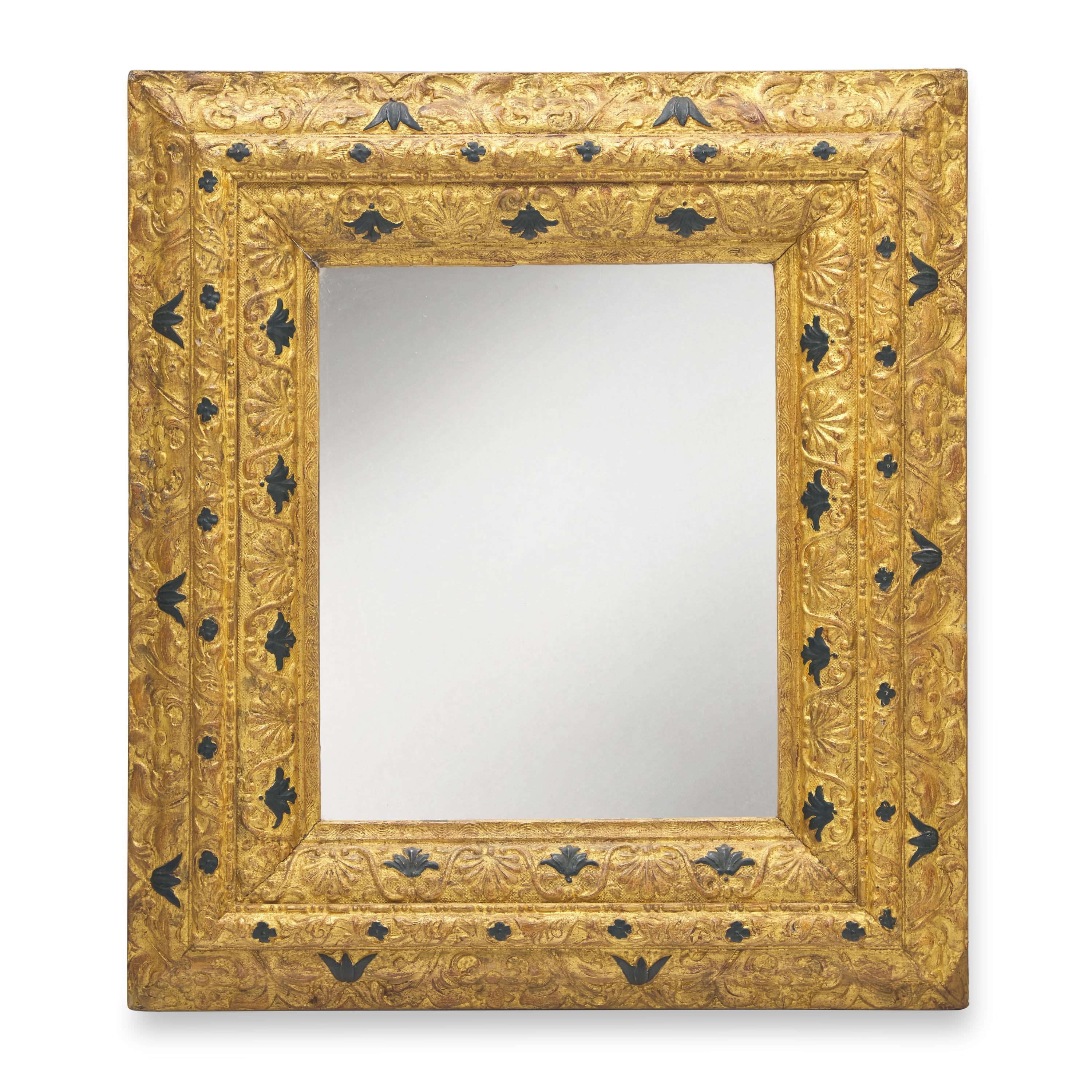A Continental Giltwood and Parcel-Ebonized Frame, Mounted as a Mirror