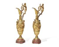 A pair of Renaissance Revival gilt bronze and rouge marble ewers, late 19th century