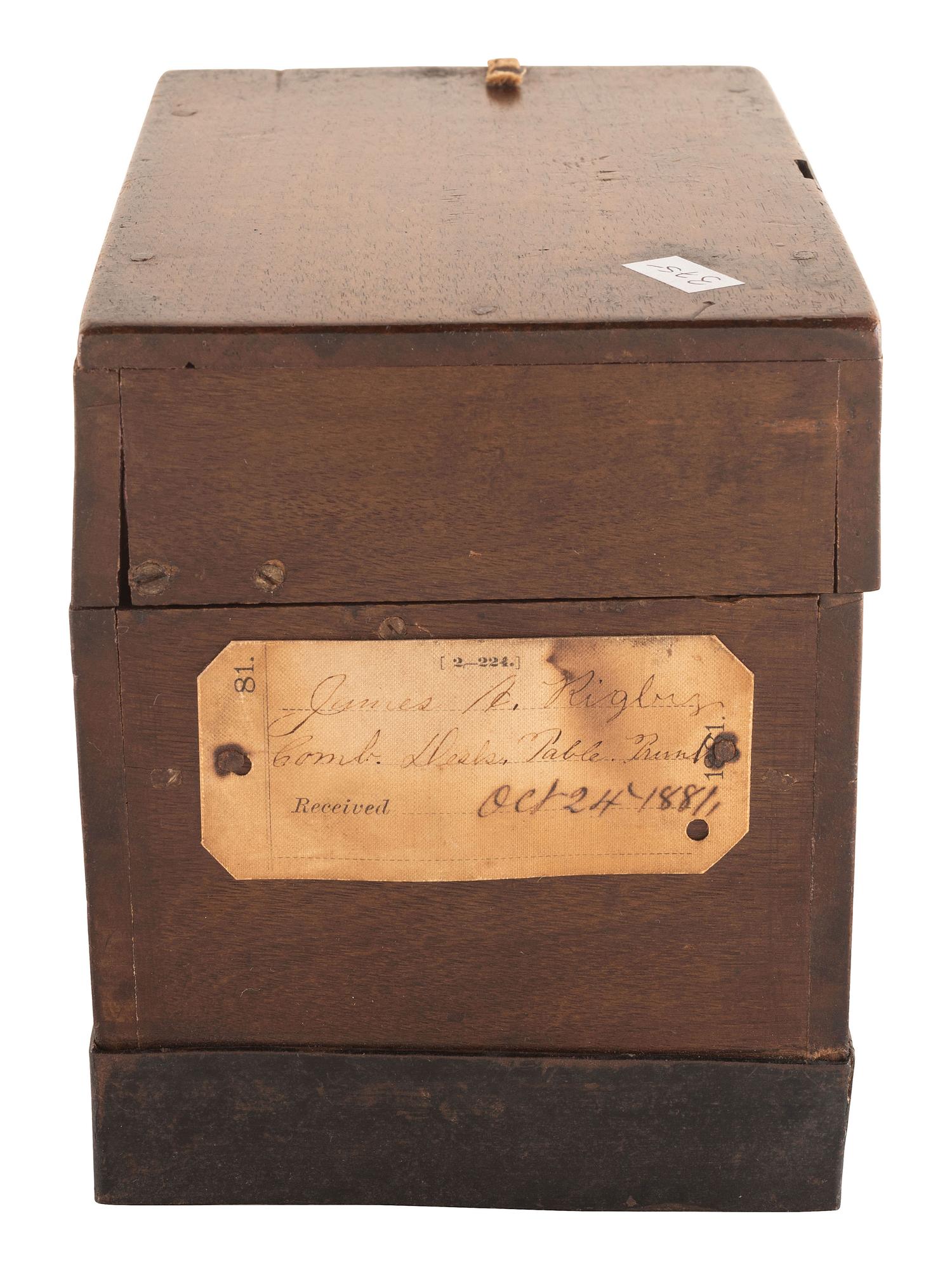 [SCIENCE & TECHNOLOGY]. James A. Rigby patent model for a "Combined Trunk, Desk, Table &c." with original tags, 1882.