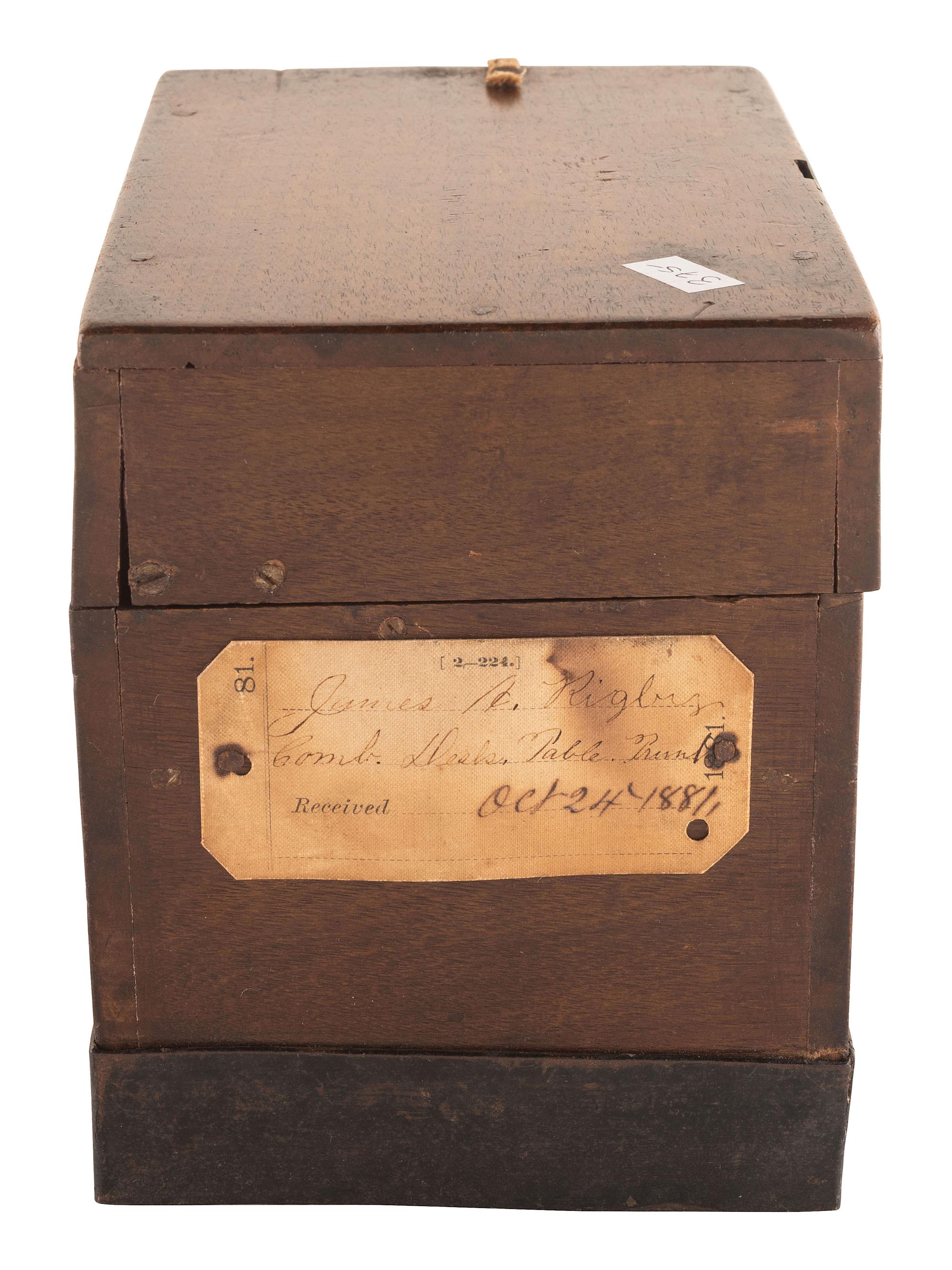 [SCIENCE & TECHNOLOGY]. James A. Rigby patent model for a "Combined Trunk, Desk, Table &c." with original tags, 1882.