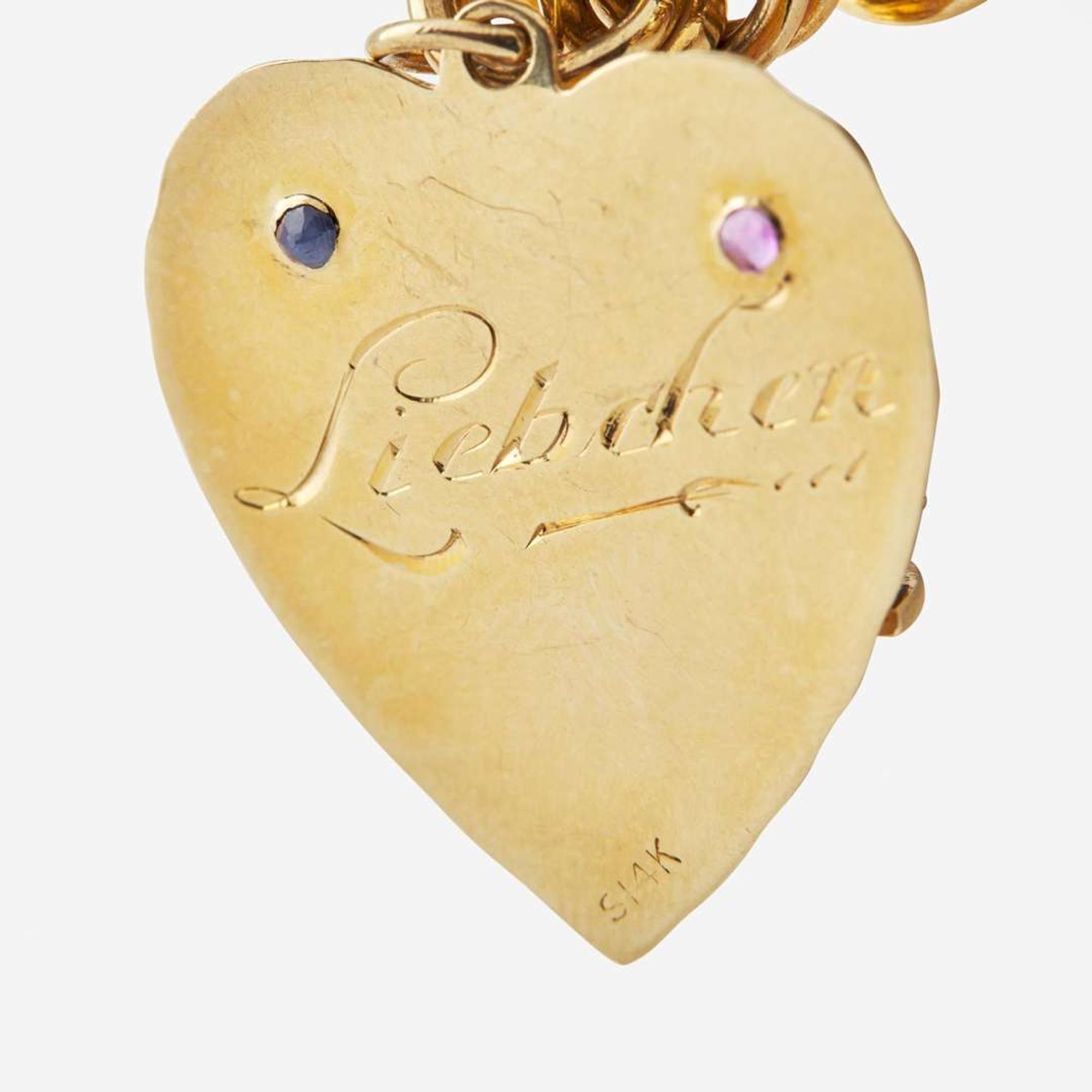 A 14K Yellow Gold Charm Bracelet with 14K Yellow Gold and Gemstone Charms