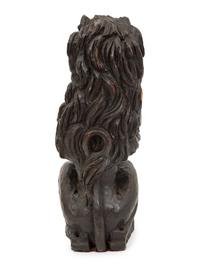 An English Carved and Stained Oak Figure of a Lion