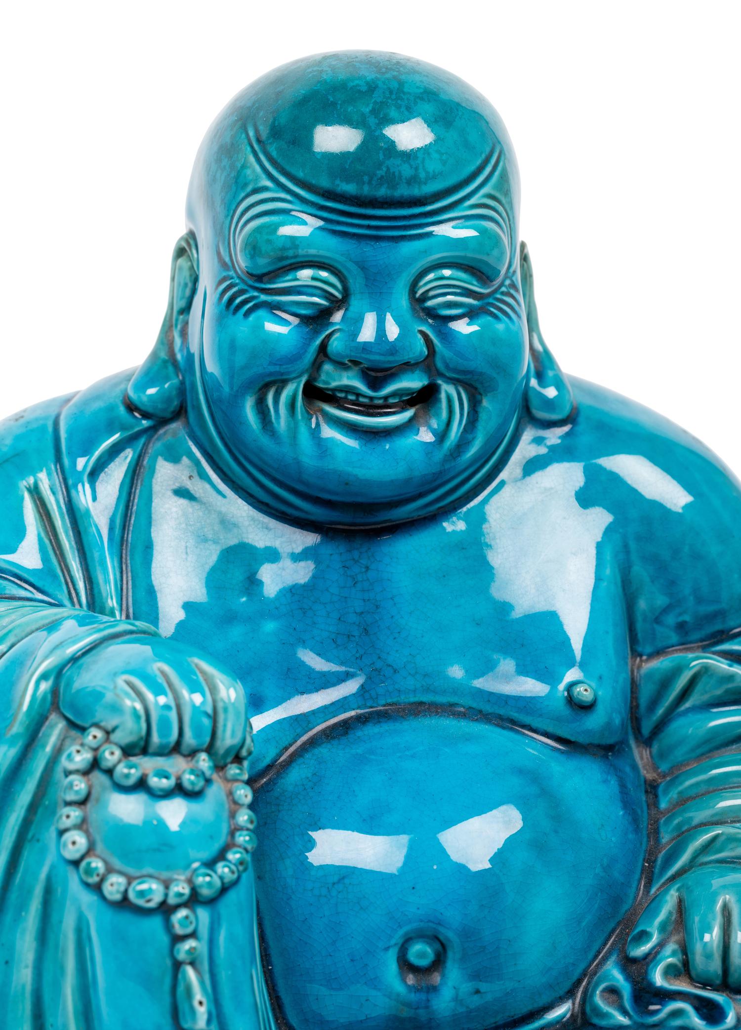 Two Turquoise Glazed Porcelain Figures of Immortals