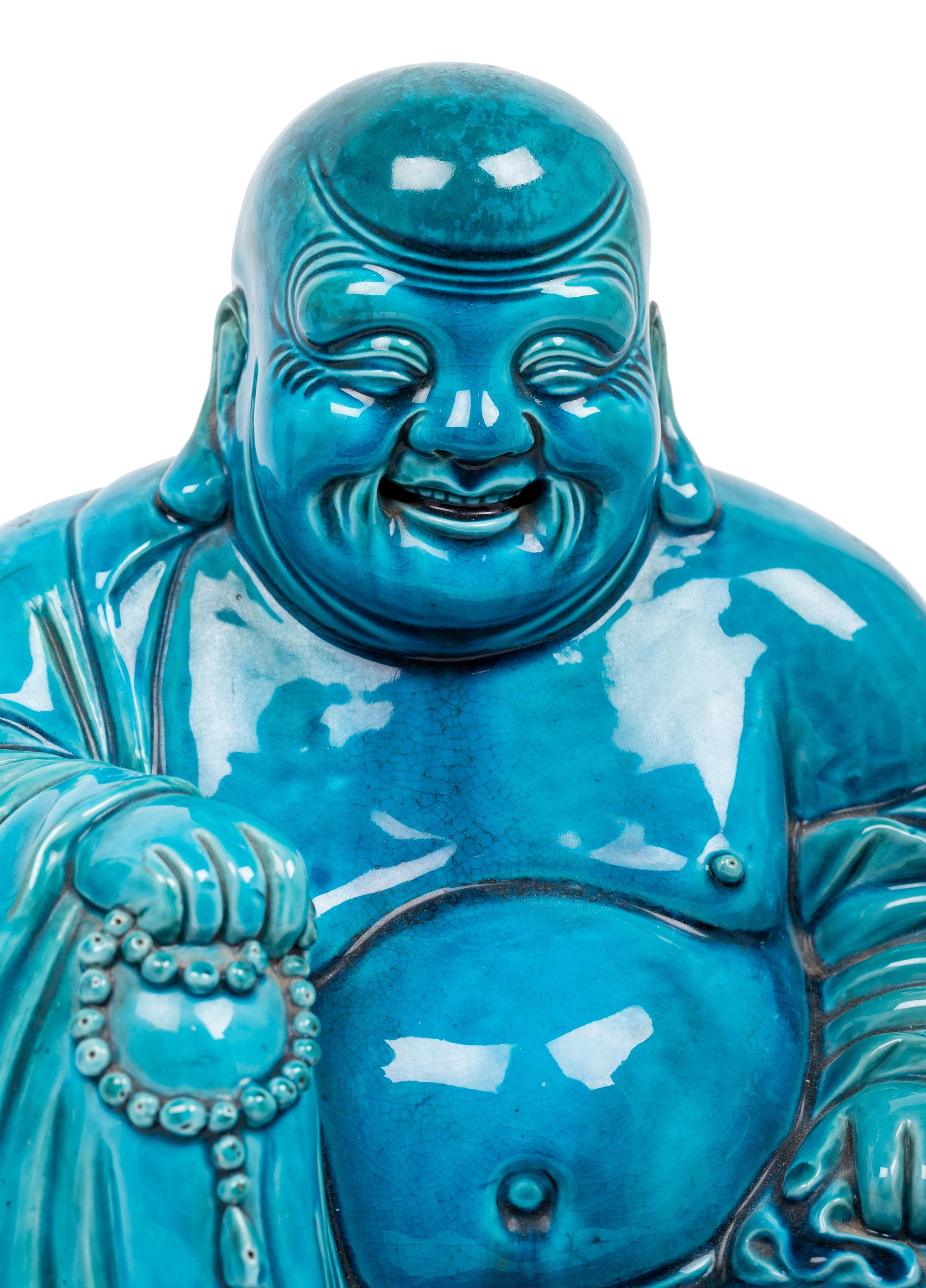 Two Turquoise Glazed Porcelain Figures of Immortals