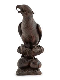 A Japanese Style Carved Rosewood Hawk with Chicks