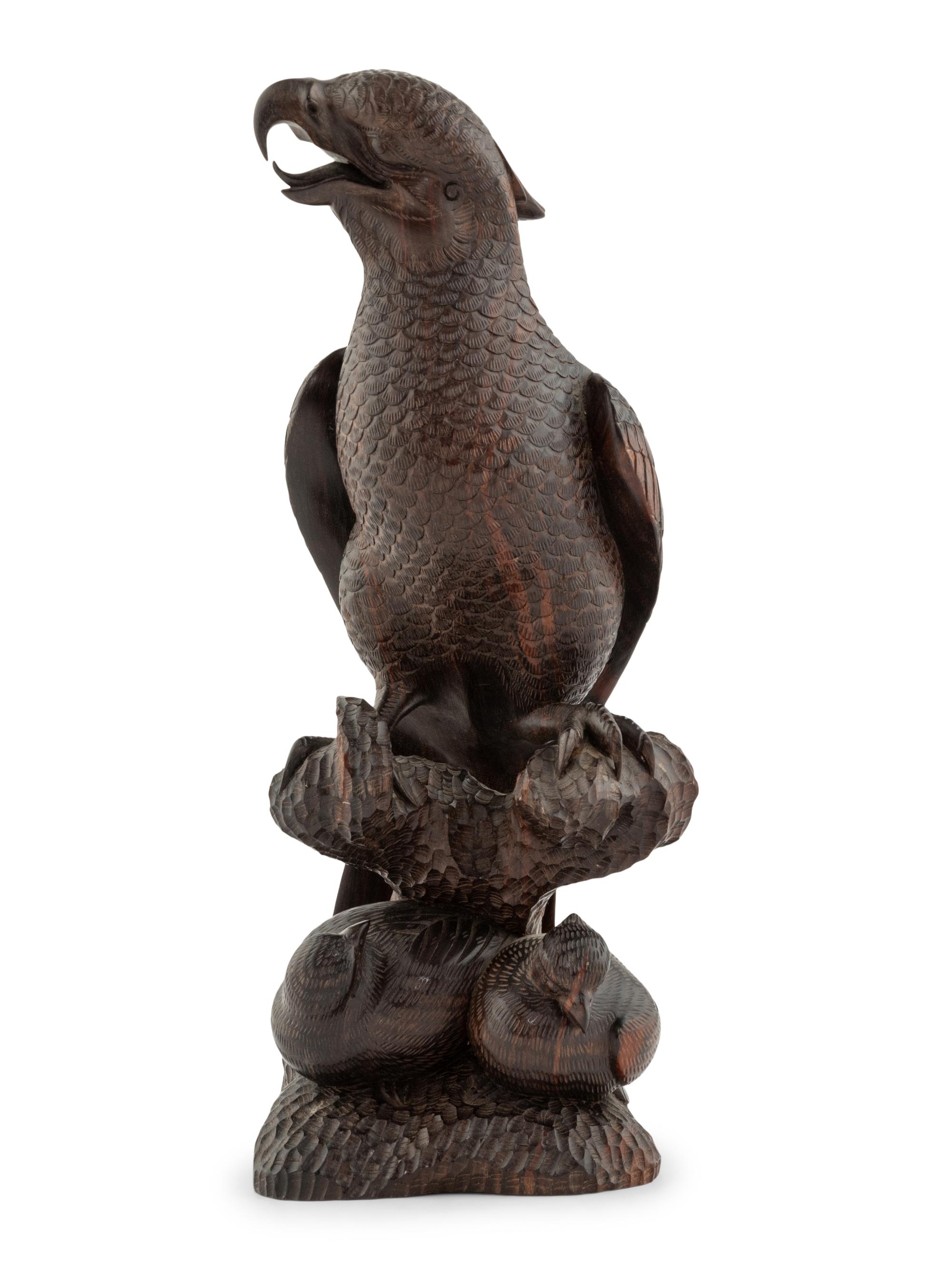 A Japanese Style Carved Rosewood Hawk with Chicks