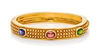An 18 Karat Yellow Gold, Tanzanite, Pink Tourmaline and Diopside Bangle Bracelet, 35.00 dwts.