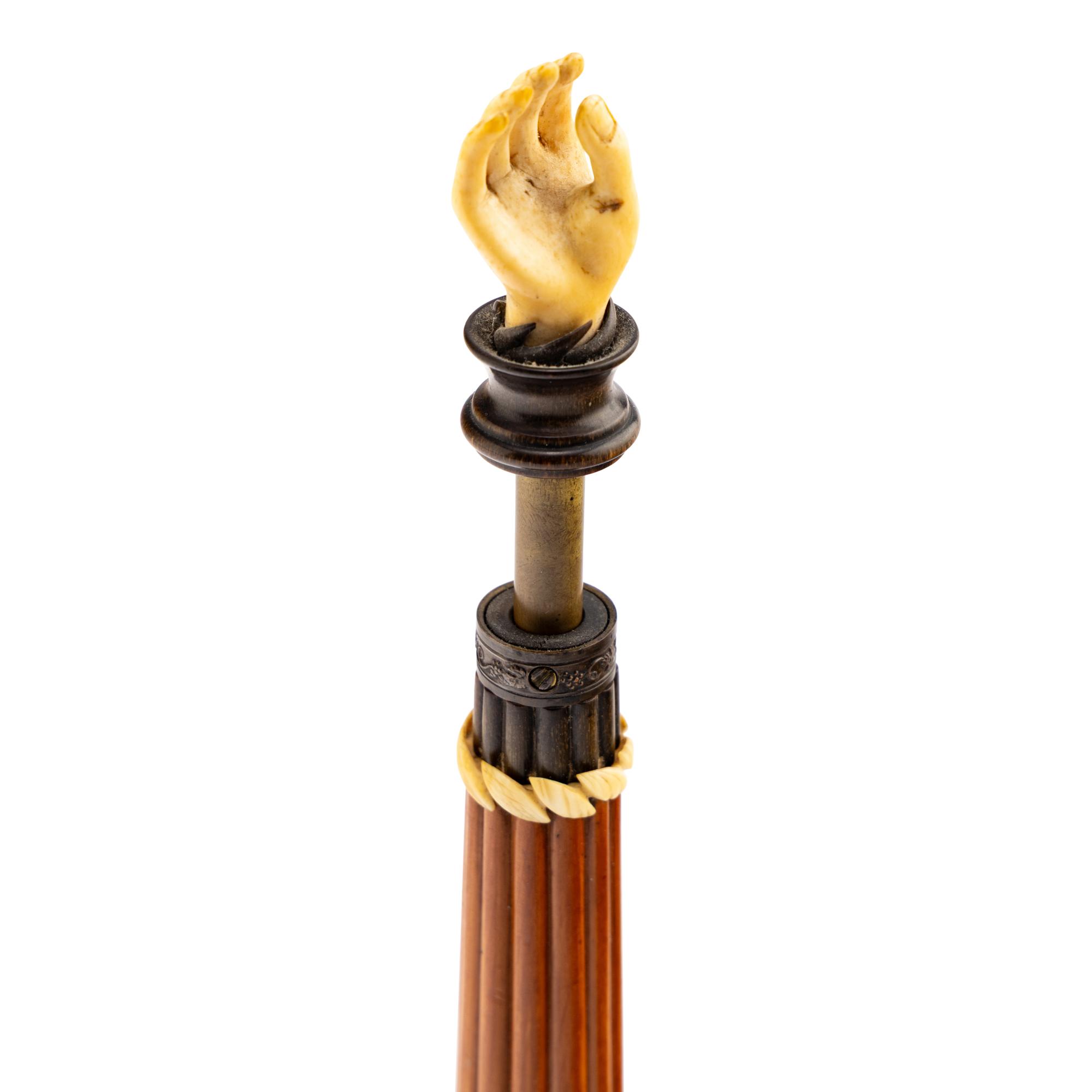 An Austrian Carved and Parcel-Ebonized Columnar Adjustable Quill Stand