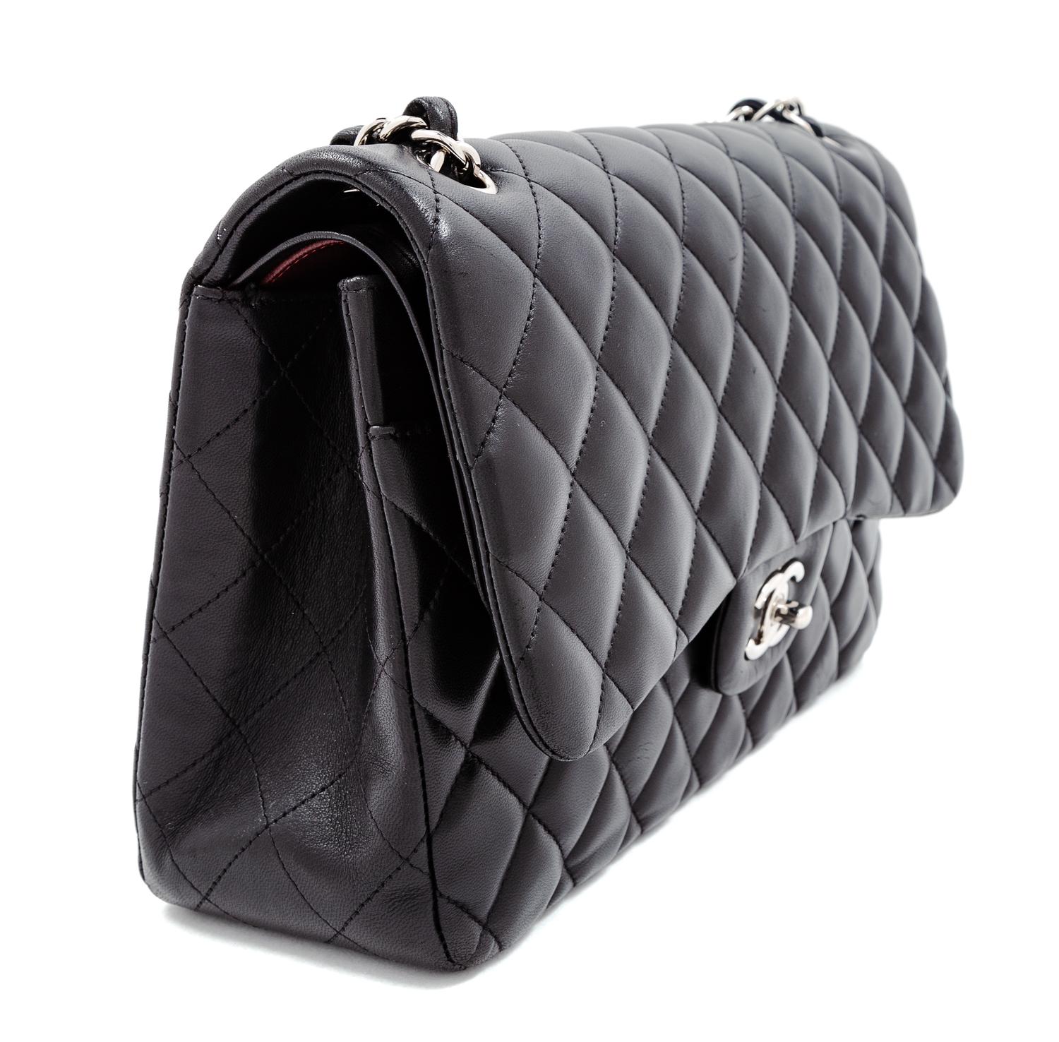 A Chanel Black Quilted Lambskin Jumbo Double Flap Bag, 8.25" H x 12" W x 3.5" D; Strap drop: 13.5"- 23.75".