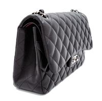 A Chanel Black Quilted Lambskin Jumbo Double Flap Bag, 8.25" H x 12" W x 3.5" D; Strap drop: 13.5"- 23.75".