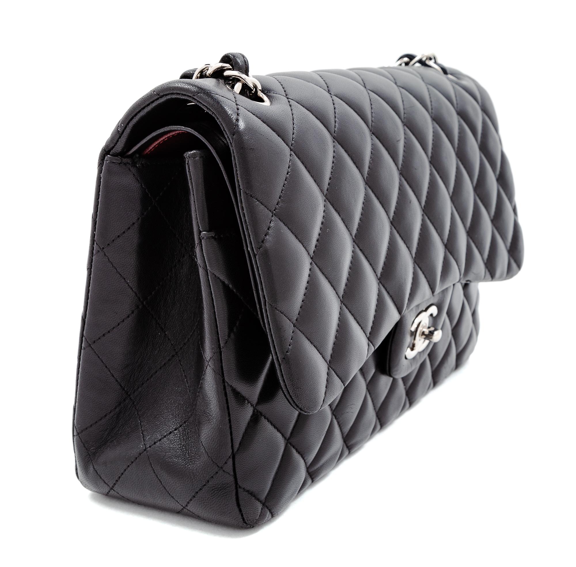 A Chanel Black Quilted Lambskin Jumbo Double Flap Bag, 8.25" H x 12" W x 3.5" D; Strap drop: 13.5"- 23.75".
