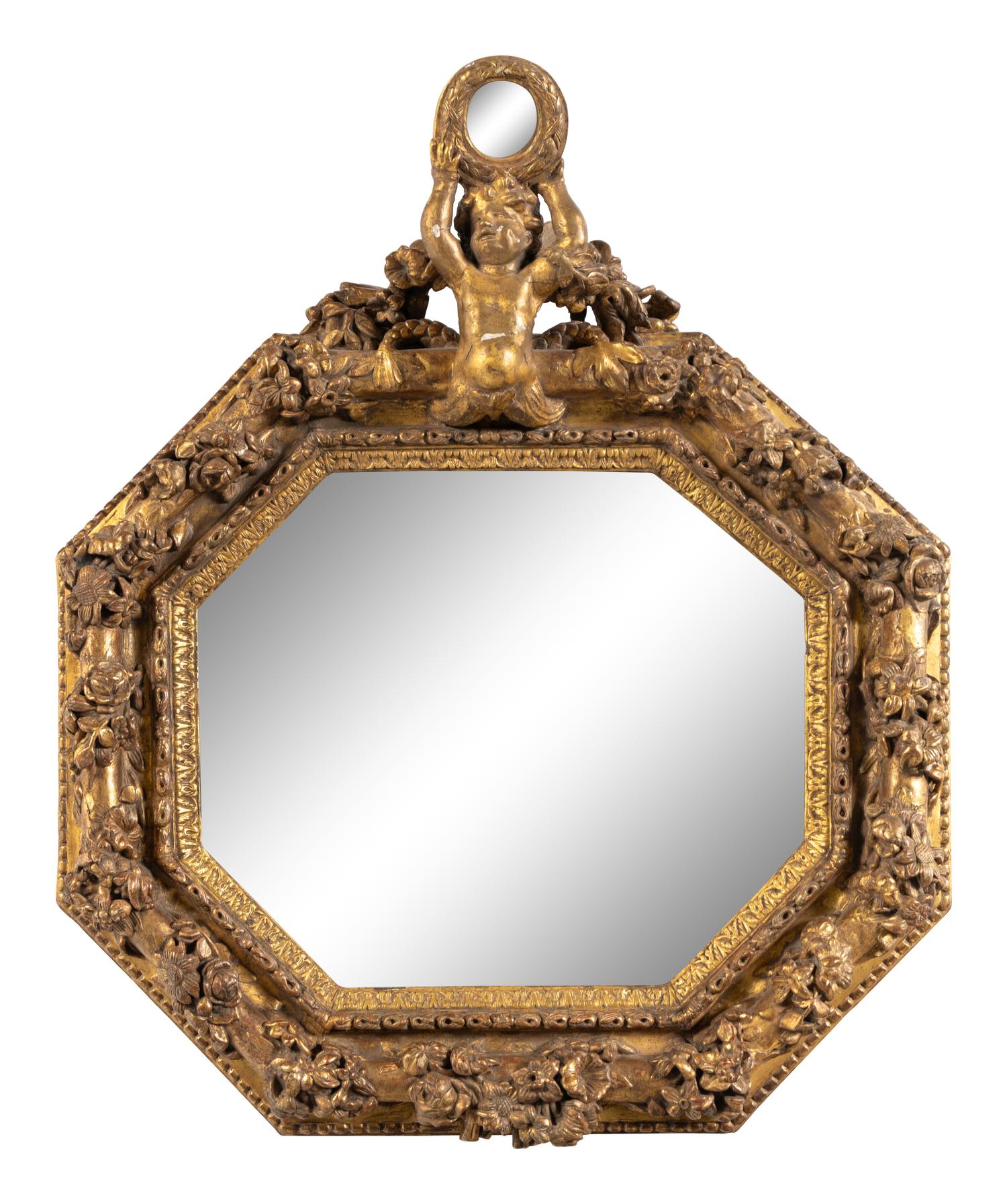 An Italian Baroque Style Giltwood Mirror