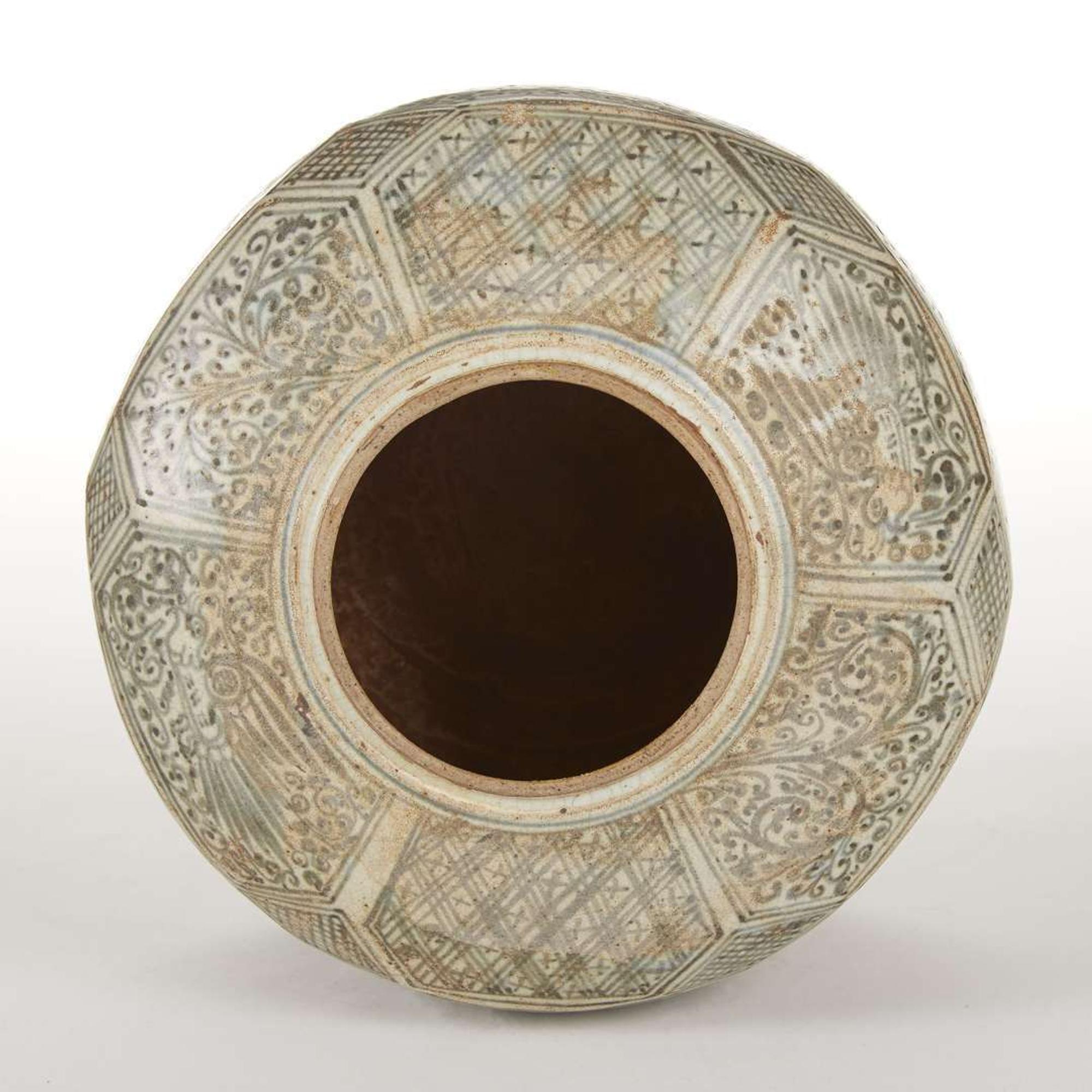 A large Thai underglaze blue-decorated stoneware faceted jar and cover. possibly 14th-16th century