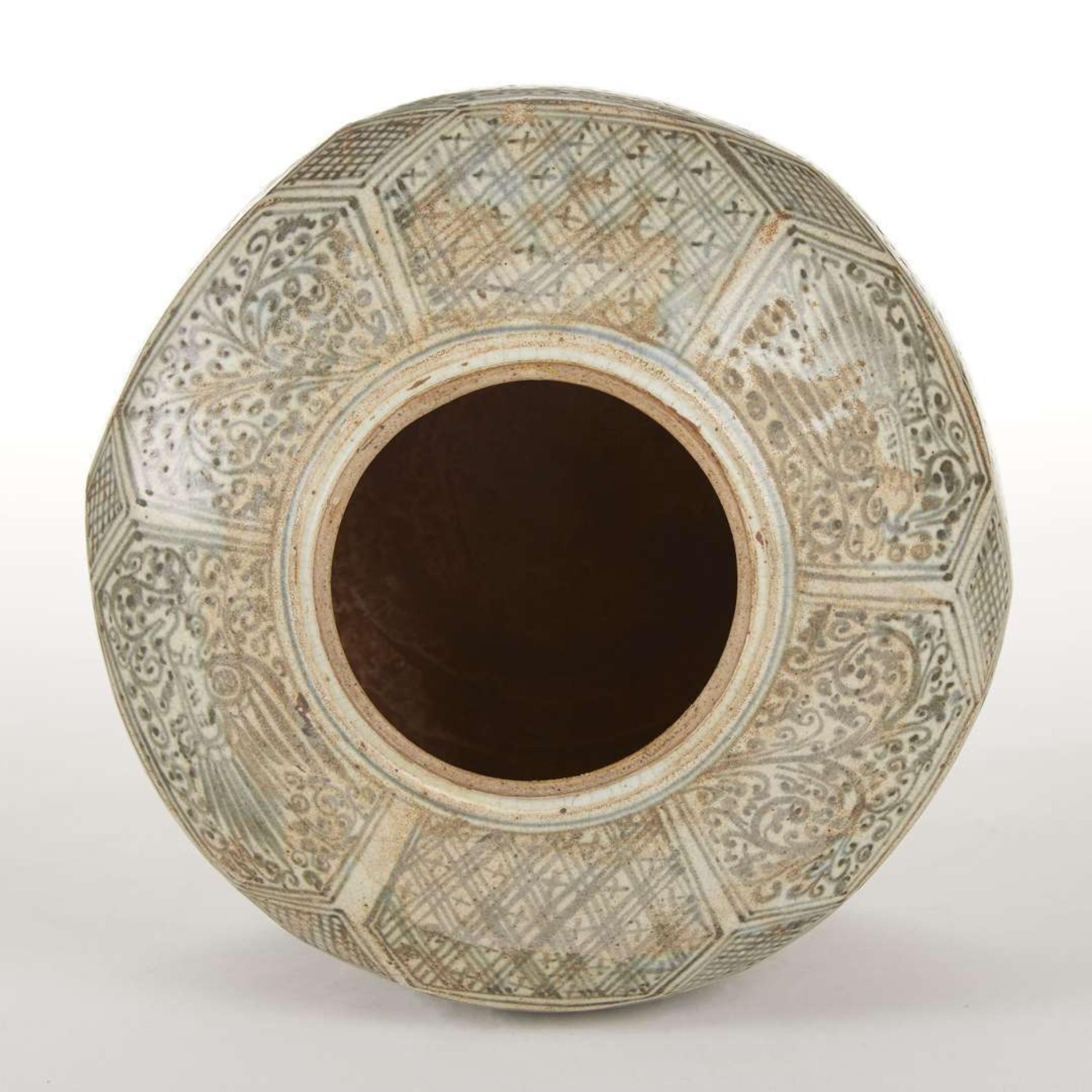 A large Thai underglaze blue-decorated stoneware faceted jar and cover. possibly 14th-16th century