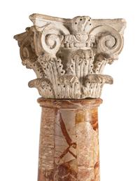 A Pair of Carved Limestone Capitals with Breccia Marble Columns