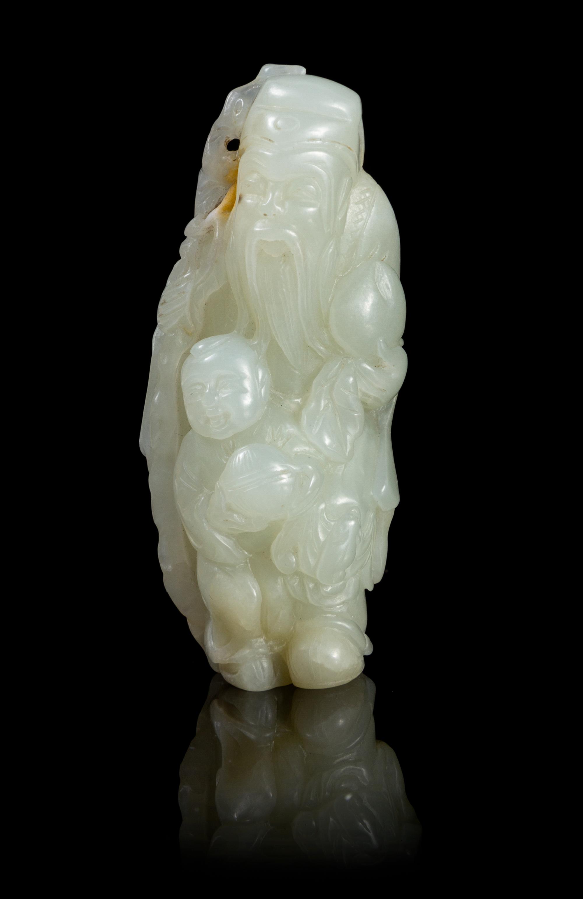 A Celadon Jade Figural Group Height 2 5/8 inches.